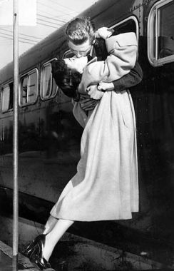 Apr. 28, 1952: Sgt. 1st Class Owen Marsh of North Hollywood leans out bus window to pick up his wife Evelyn for kiss before going to Fr. MacArthur after landing at airport. He will be discharged there.